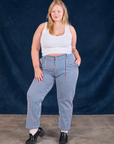 Juliet is 5'7" and wearing 1XL Stripe Work Pants in Blue Raspberry paired with a Cropped Tank in vintage tee off-white