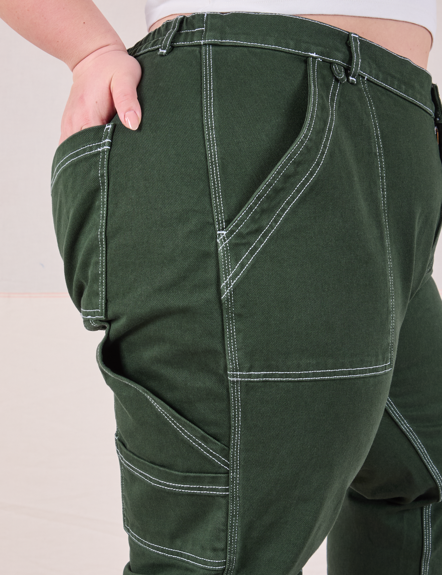 Carpenter Jeans in Swamp Green side close up on Ashley