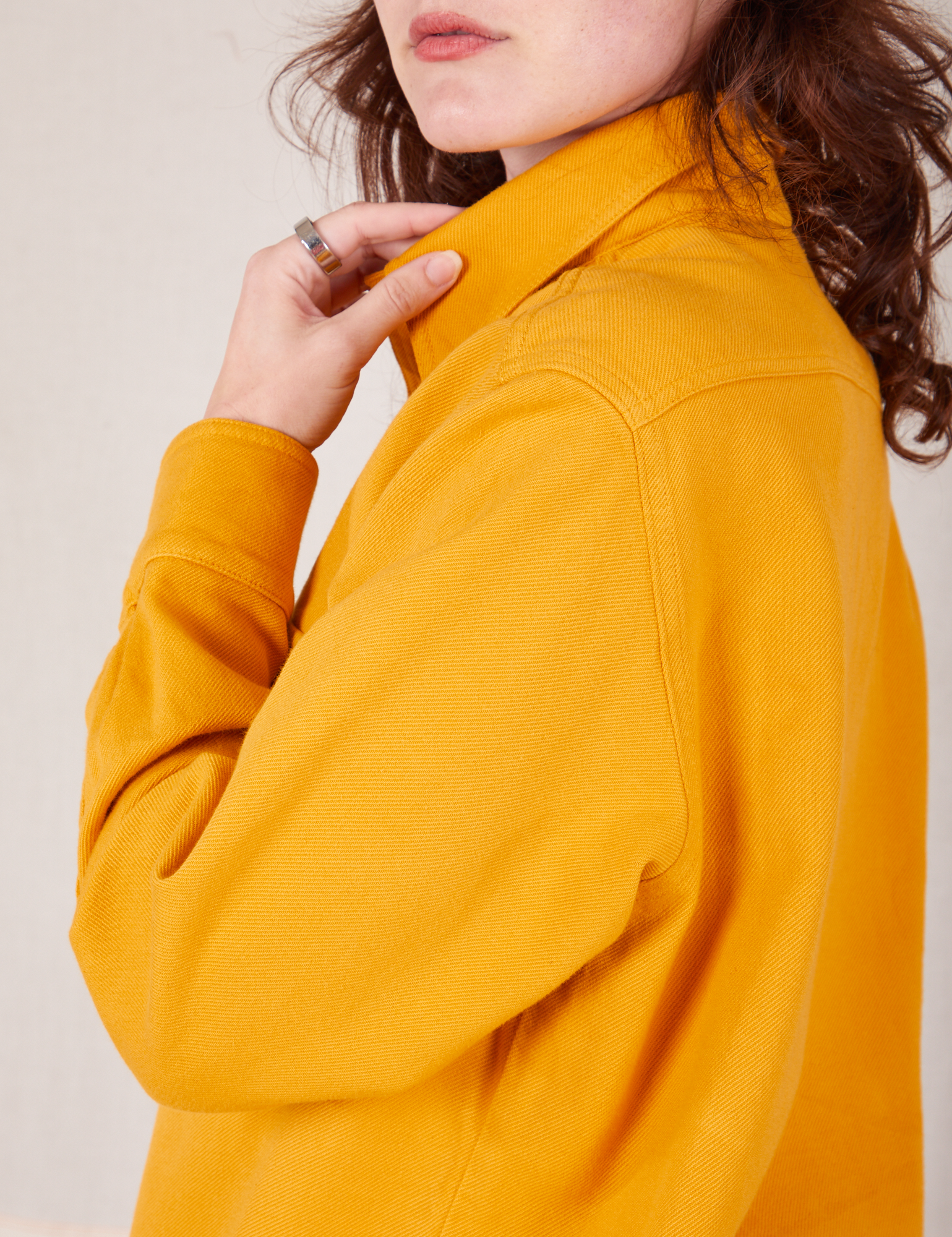 Shoulder side view close up of Flannel Overshirt in Mustard Yellow on Alex