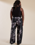Back view of Magic Waters Drop Pocket Pants in Ink Blot and black Cropped Tank on Demi