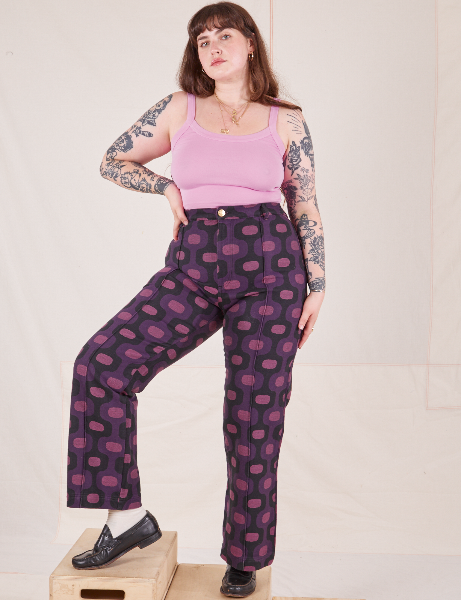 Sydney is wearing Western Pants in Purple Tile Jacquard and bubblegum pink Cami
