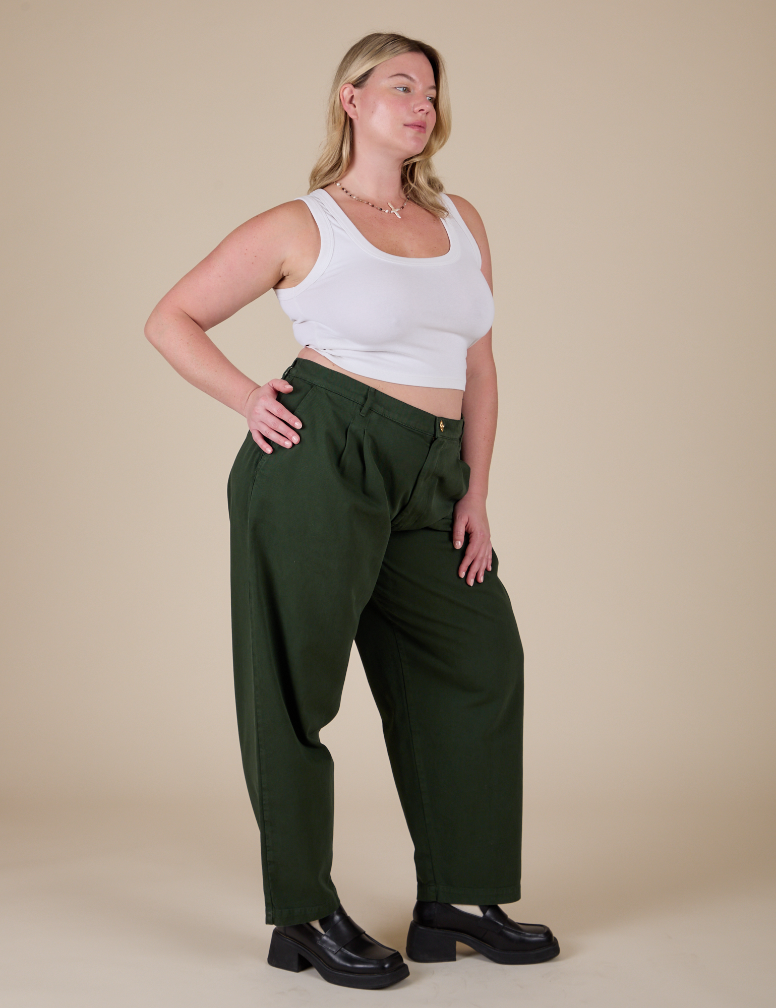 Angled front view of Heavyweight Trousers in Swamp Green and Cropped Tank in Vintage Tee White on Lish