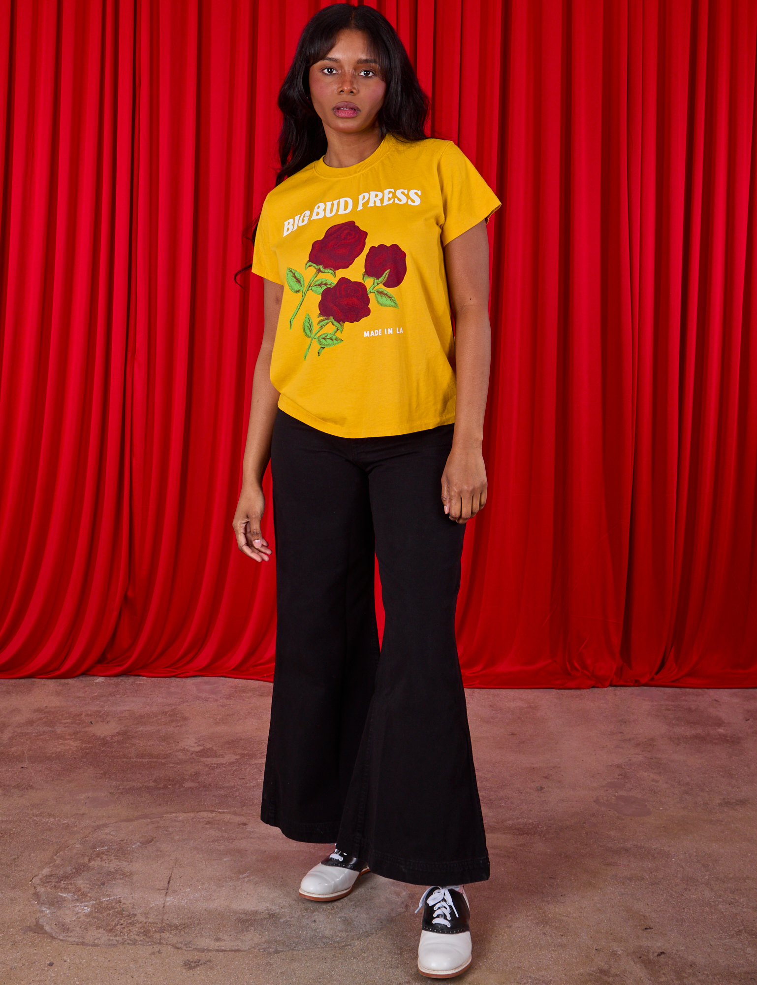 3 Roses Organic Tee and black Bell Bottoms worn by Kandia