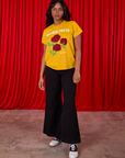 3 Roses Organic Tee and black Bell Bottoms worn by Kandia