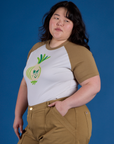Angled front view of Produce Raglan Tee in Onion on Ashley