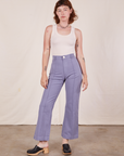 Alex is 5'8" and wearing XS Western Pants in Faded Grape paired with vintage off-white Tank Top