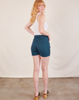 Back view of Western Shorts in Lagoon and Cropped Tank in vintage tee off-white on Margaret