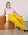 Lish is wearing Western Pants in Golden Yellow and Cropped Tank in Vintage Tee Off-White