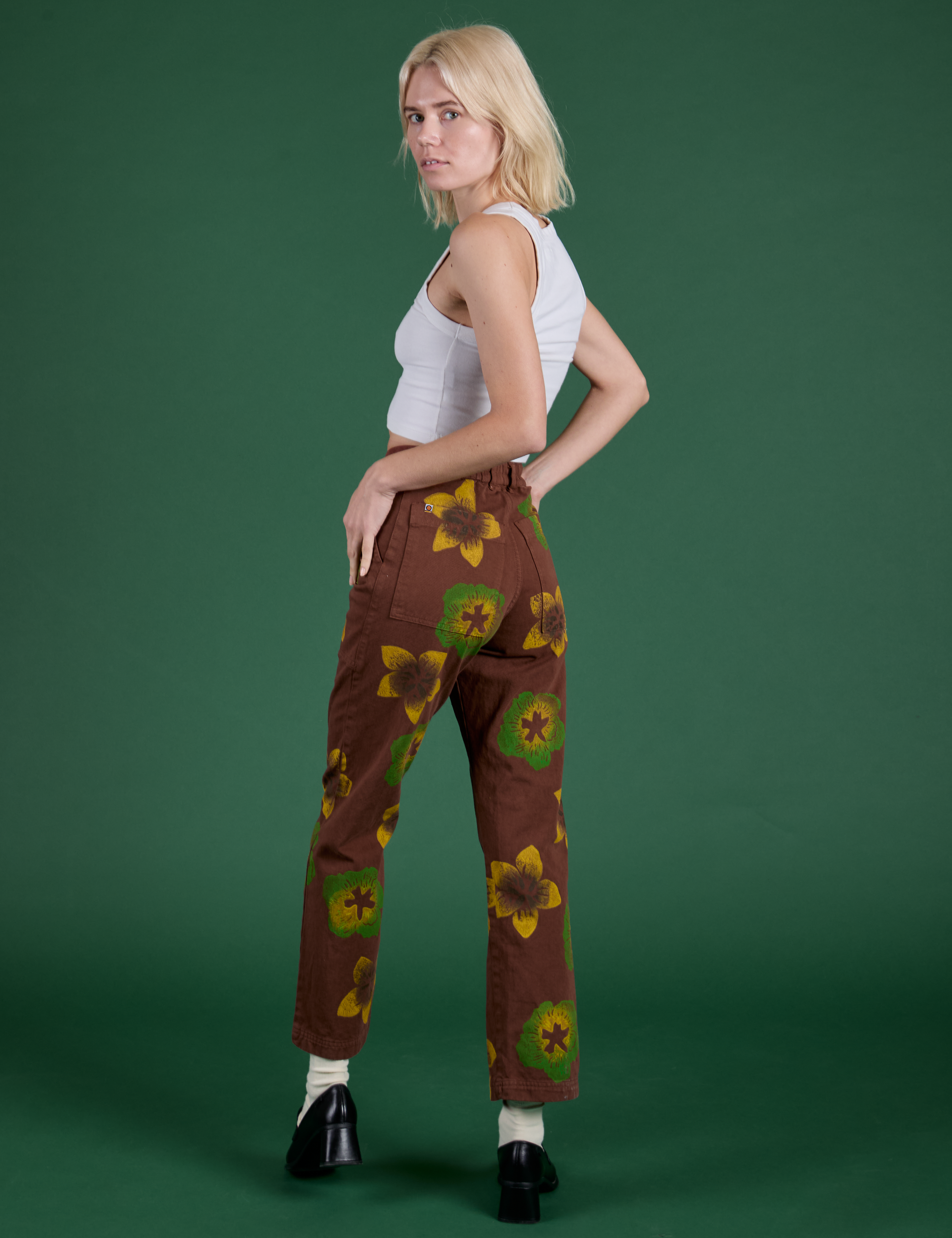 Floral Painted Work Pants in Brown angled back view on Madeline