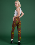 Floral Painted Work Pants in Brown angled back view on Madeline
