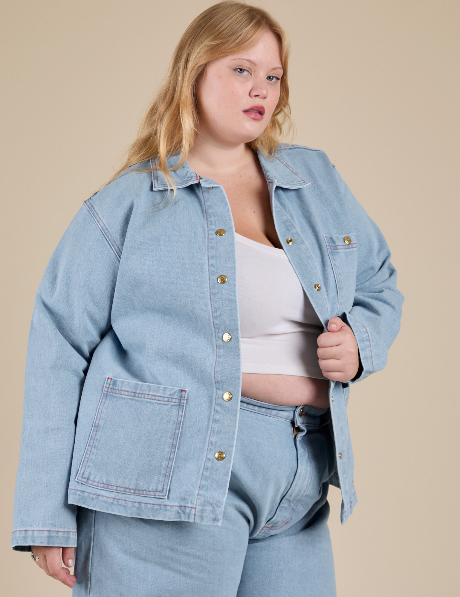 Angled front view of Indigo Denim Work Jacket in Light Wash on Juliet