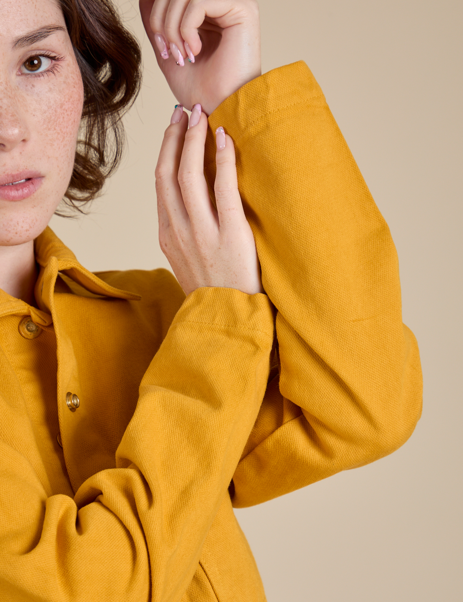 Denim Work Jacket in Mustard Yellow sleeve close up on Hana