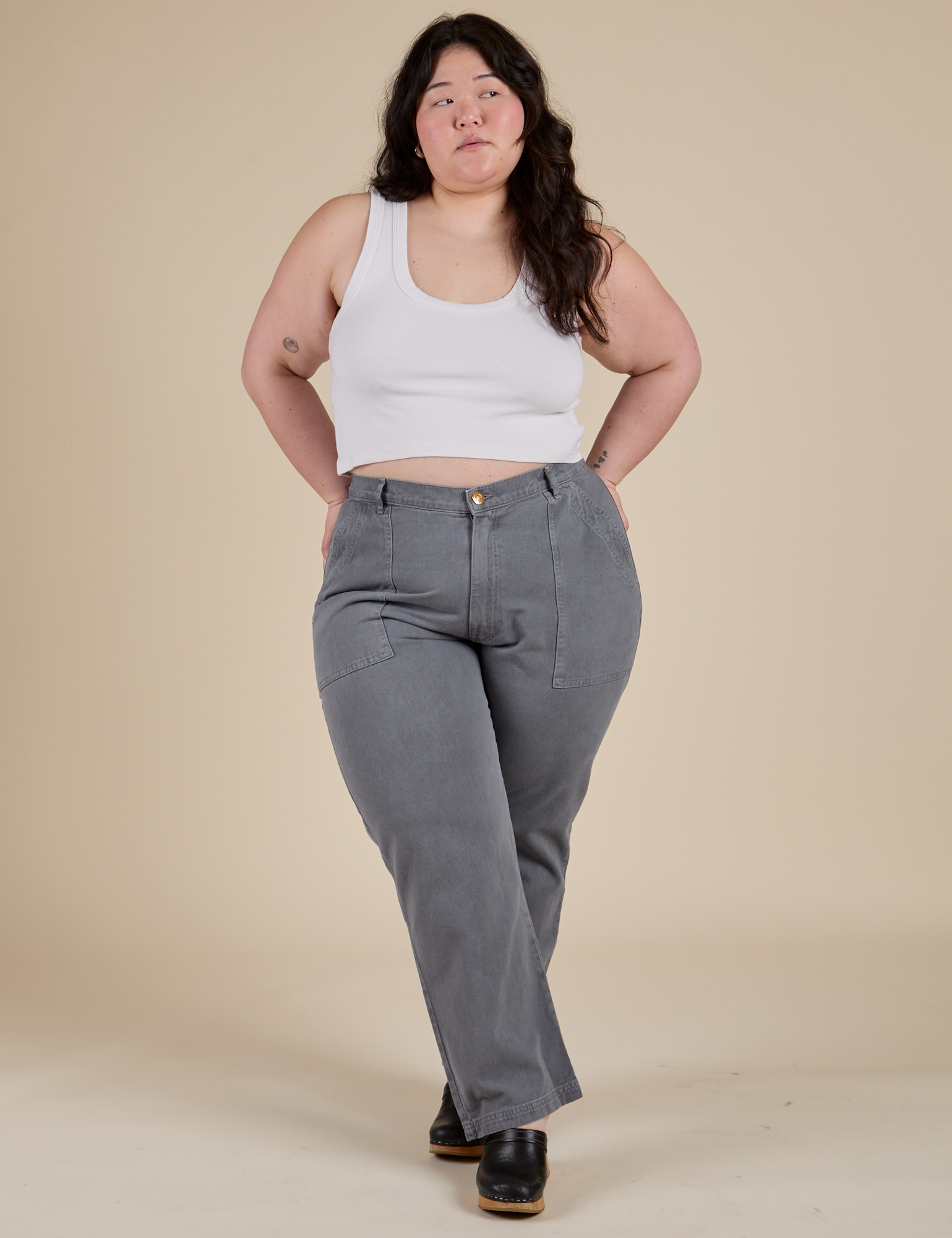 Ashley is 5’7” and wearing 1XL Work Pants in Washed Grey paired with a vintage tee white Cropped Tank 