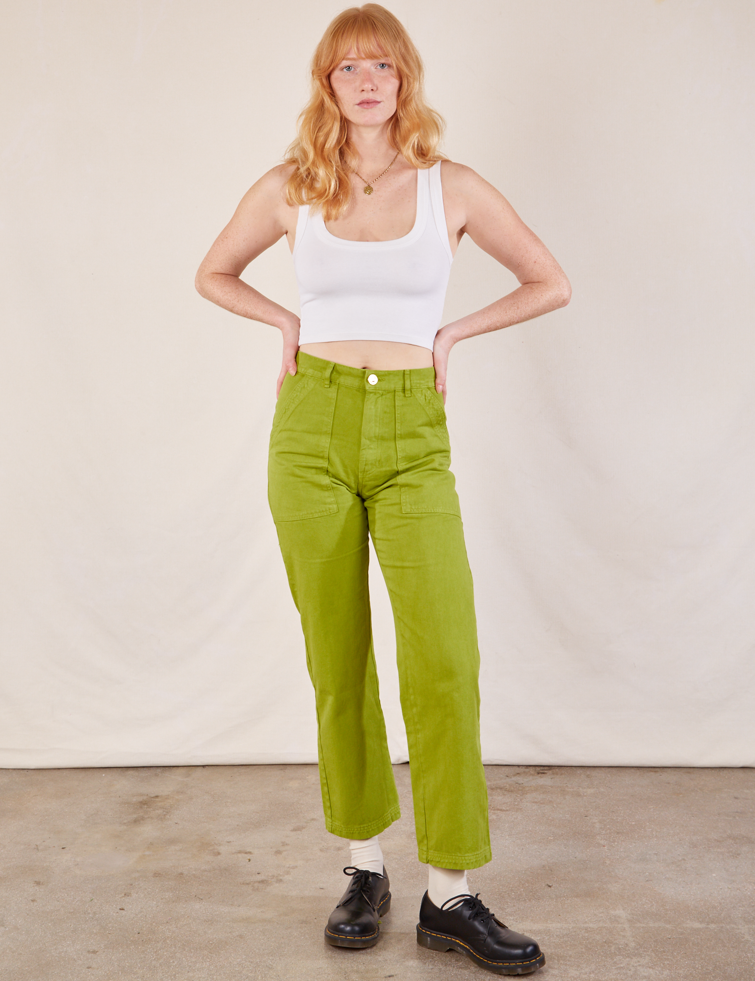 Margaret is 5&#39;11” and wearing XS Work Pants in Gross Green paired with a Cropped Tank in vintage tee off-white