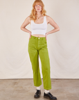 Margaret is 5'11” and wearing XS Work Pants in Gross Green paired with a Cropped Tank in vintage tee off-white