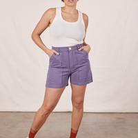 Tiara is 5'4" and wearing size S Classic Work Shorts in Faded Grape paired with a vintage off-white Tank Top
