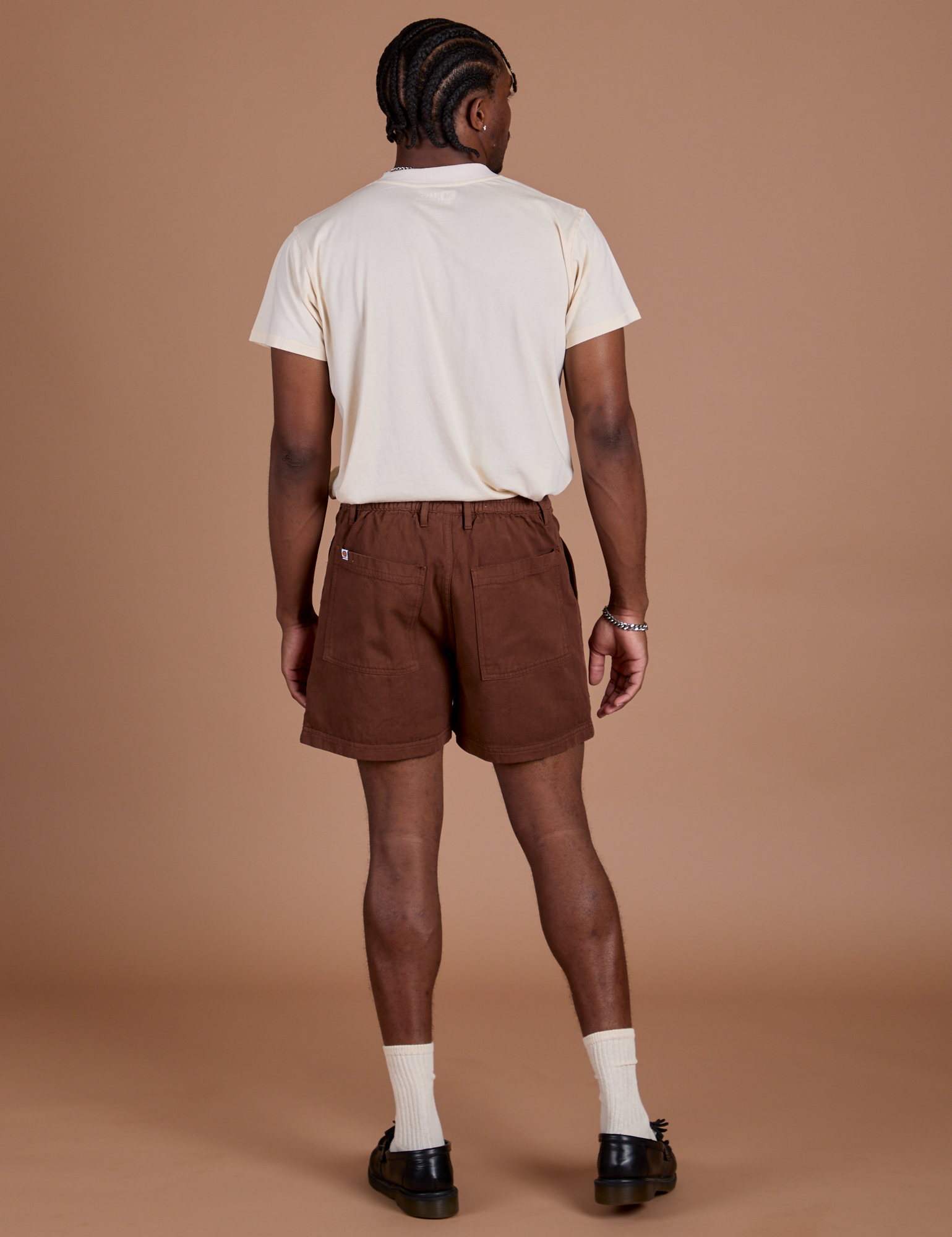 Back view of Classic Work Shorts in Fudgesicle Brown and Organic Vintage Tee in Vintage Off White on Isaac
