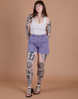 Sydney is 5’9” and wearing M Classic Work Shorts in Faded Grape paired with a Cropped Tank in Vintage Tee White