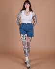 Sydney is 5’9” and wearing M Classic Work Shorts in French Blue paired with a Cropped Tank in Vintage Tee White
