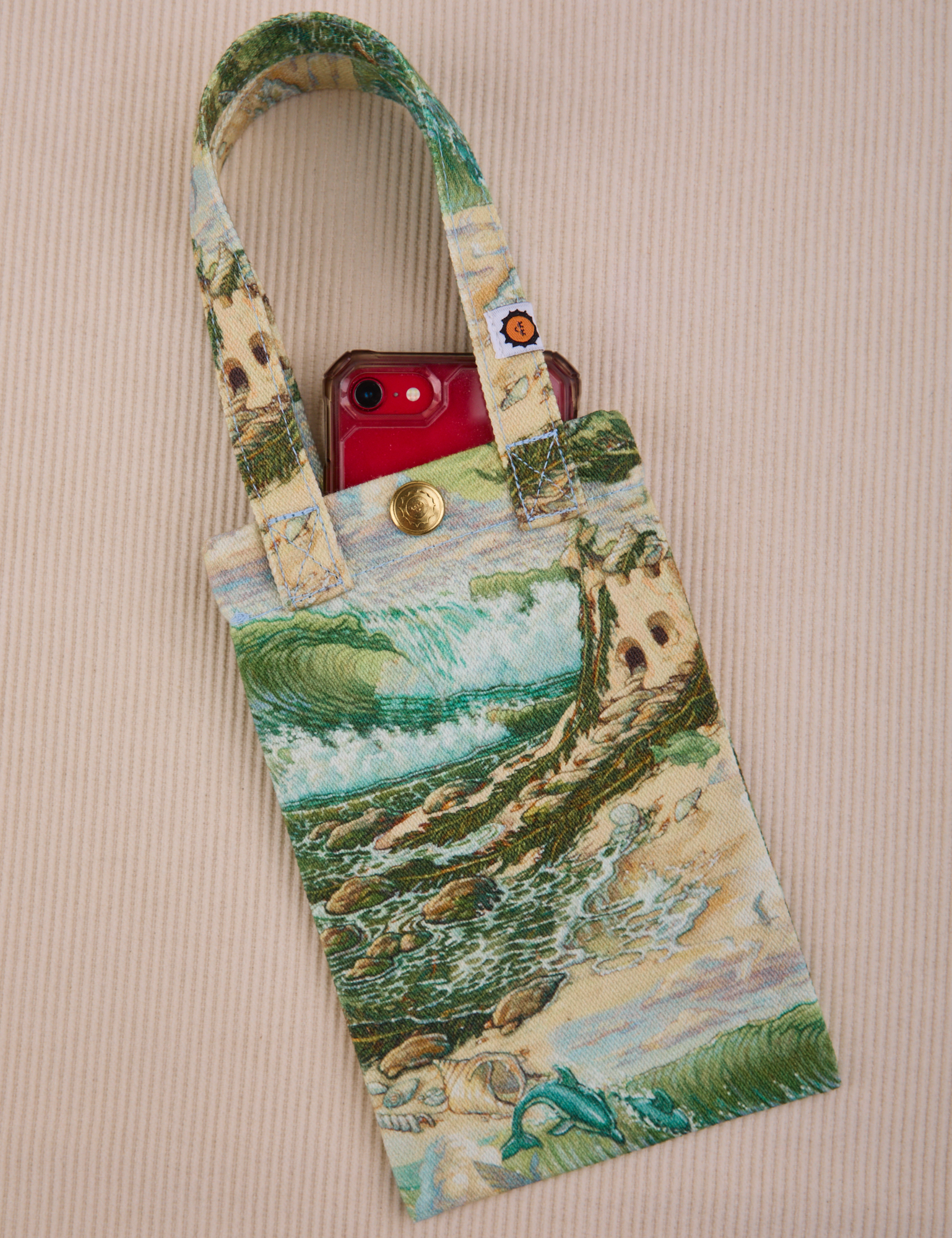 Ocean and Sky Printed Phone Tote with phone in it.