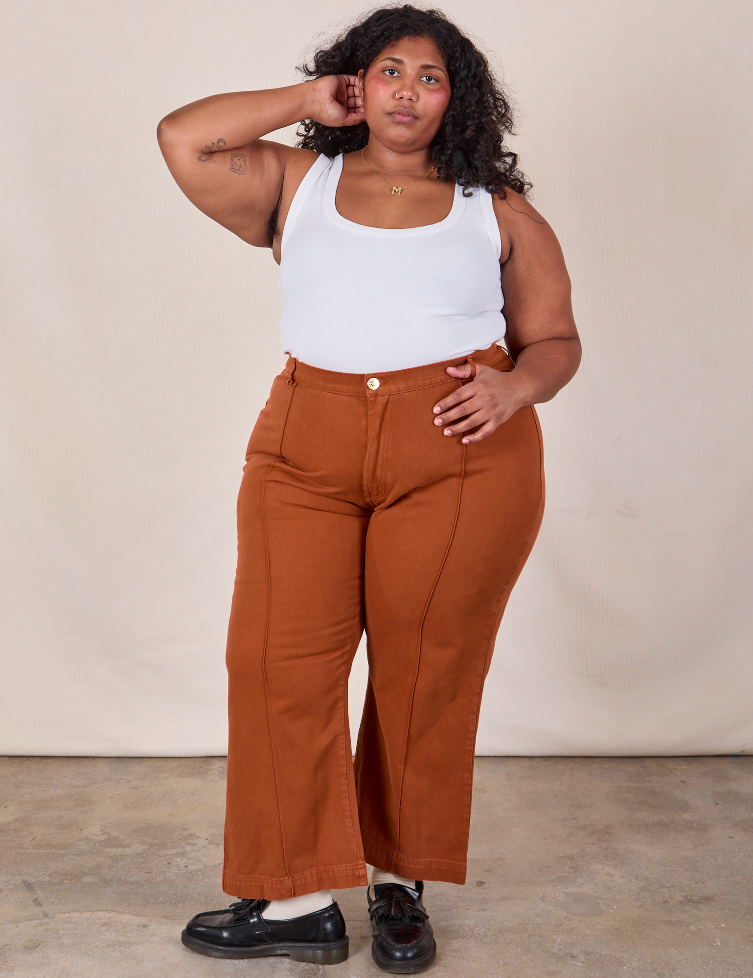 Morgan is 5&#39;5&quot; and wearing 2XL Western Pants in Burnt Terracotta paired with a Cropped Tank in Vintage Tee Off-White