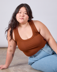 Ashley is wearing Cropped Tank Top in Burnt Terracotta