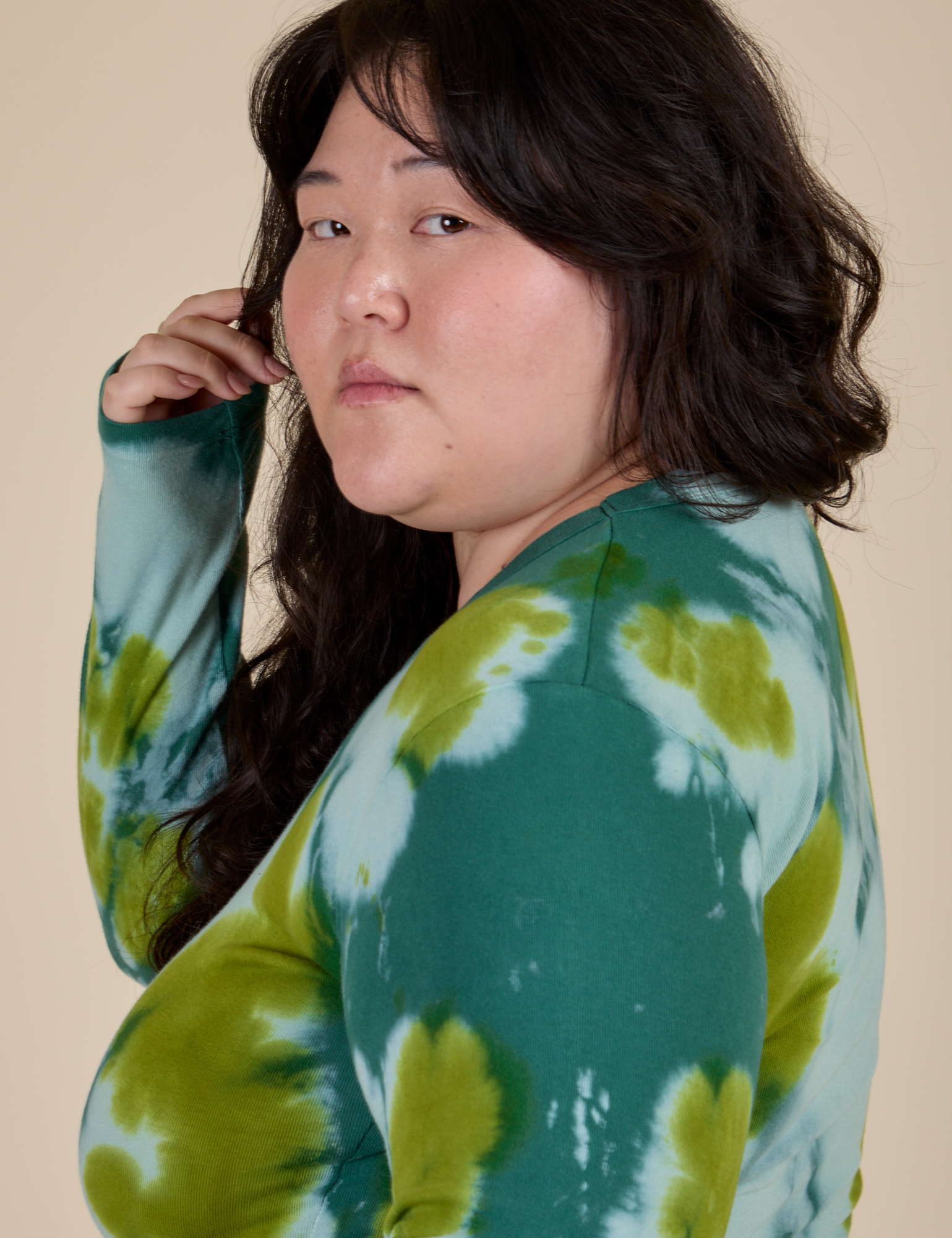 Side view close up of Long Sleeve Baby Tee in Green Magic Waters on Ashley