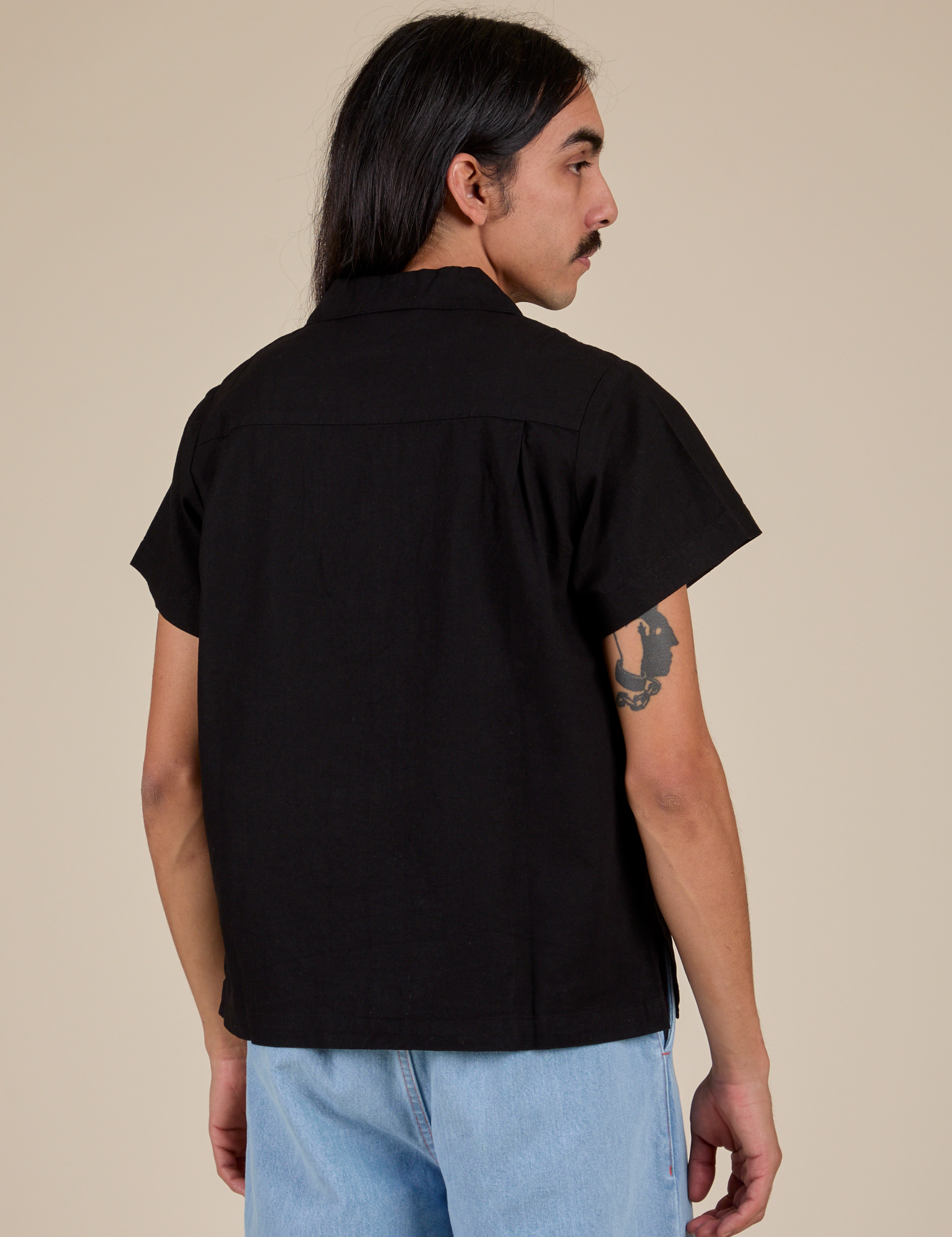 Pantry Button-Up in Basic Black back view on Anthony