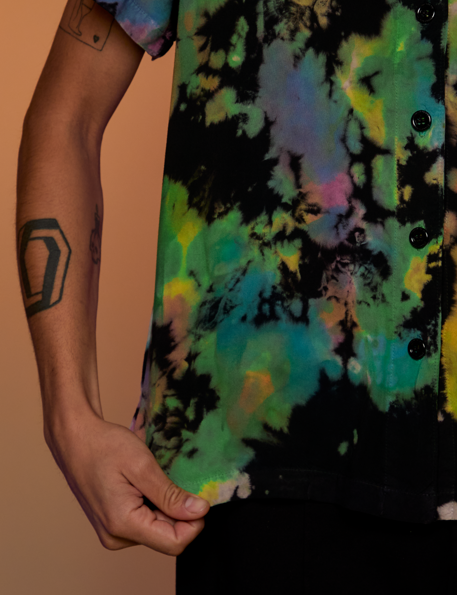 Pantry Button-Up in Rainbow Magic Waters bottom hem close up on Anthony