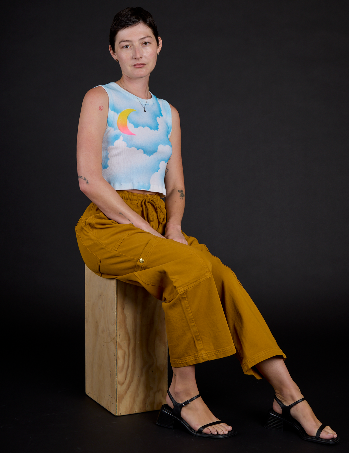 Alex wearing the Morning Moon Airbrush Muscle Tee with the Spicy Mustard Drop Pocket Cargo Pants