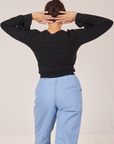 Back view of Bell Sleeve Top in Basic Black and light wash Trouser Jeans worn by Tiara
