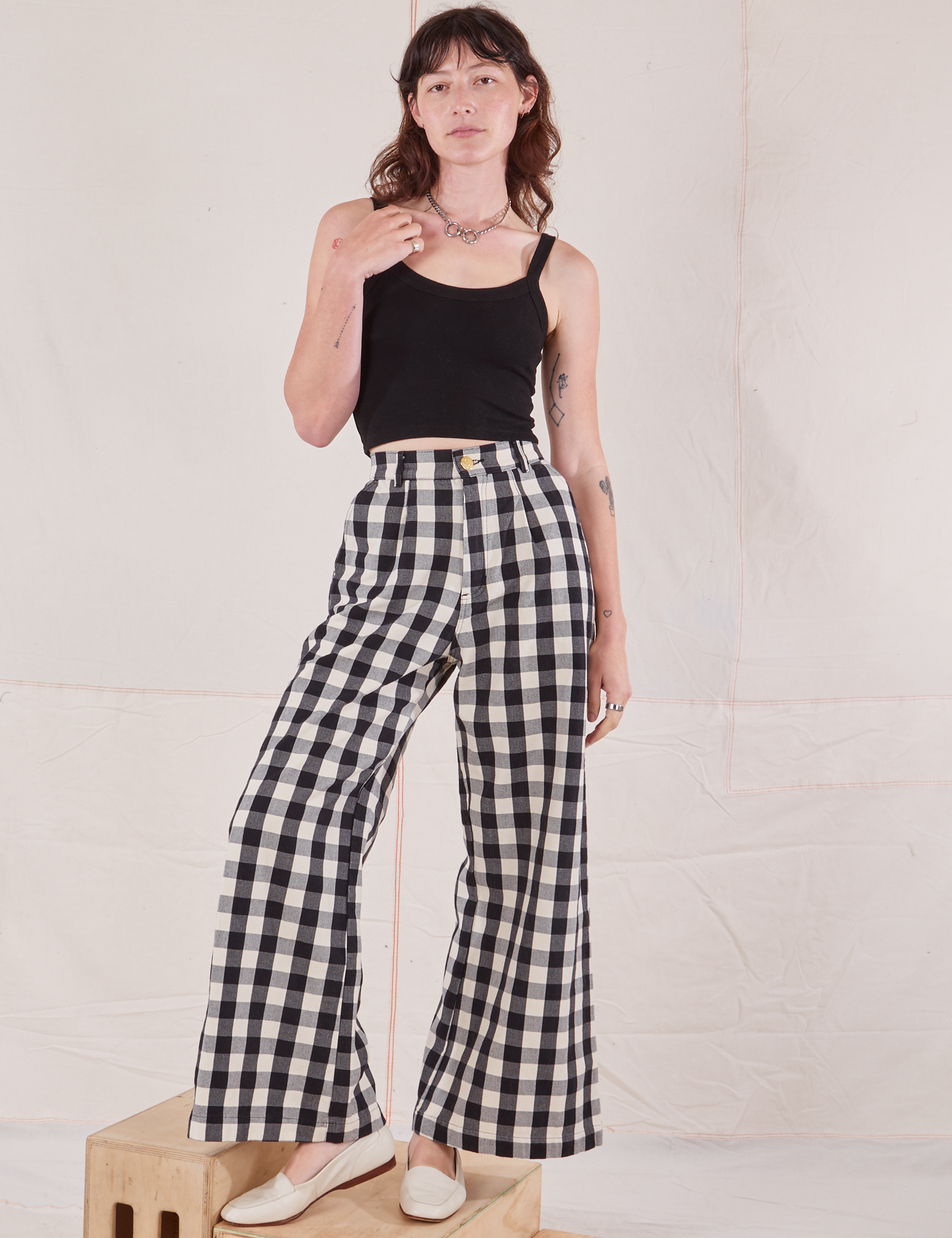 Alex is 5&#39;8&quot; and wearing XXS Wide Leg Trousers in Big Gingham paired with black Cropped Cami