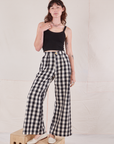 Alex is 5'8" and wearing XXS Wide Leg Trousers in Big Gingham paired with black Cropped Cami