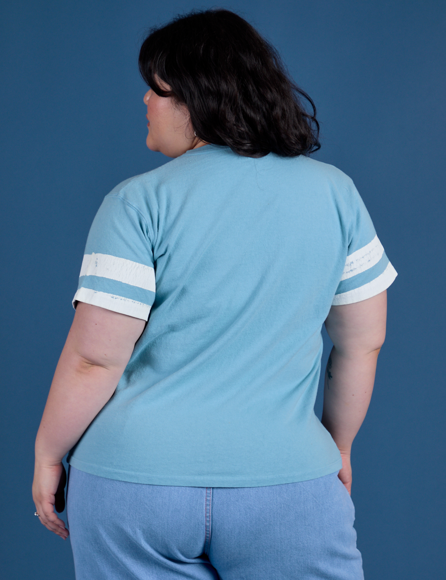 Painted Burly Tee in Baby Blue back view on Ashley