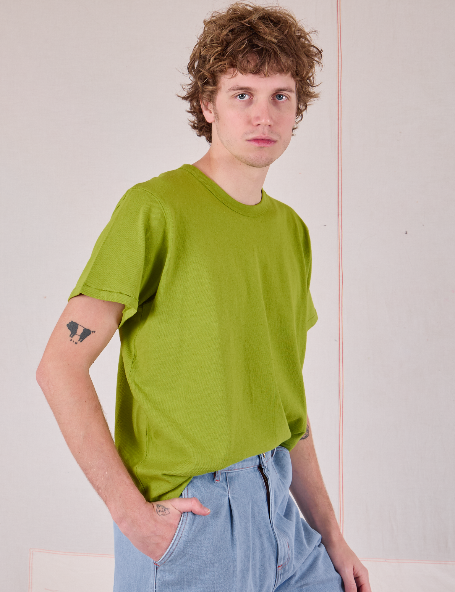 Burly Tee in Gross Green side view on Quinn