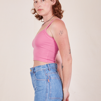 Side view of Cropped Cami in Bubblegum Pink and light wash Frontier Jeans worn by Alex