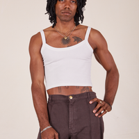 Jerrod is 6'3" and wearing S Cropped Cami in Vintage Off-White paired with espresso brown Western Pants