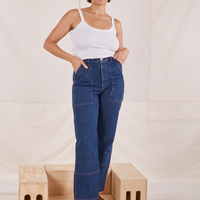 Tiara is wearing Carpenter Jeans in Dark Wash and a vintage off-white Cami
