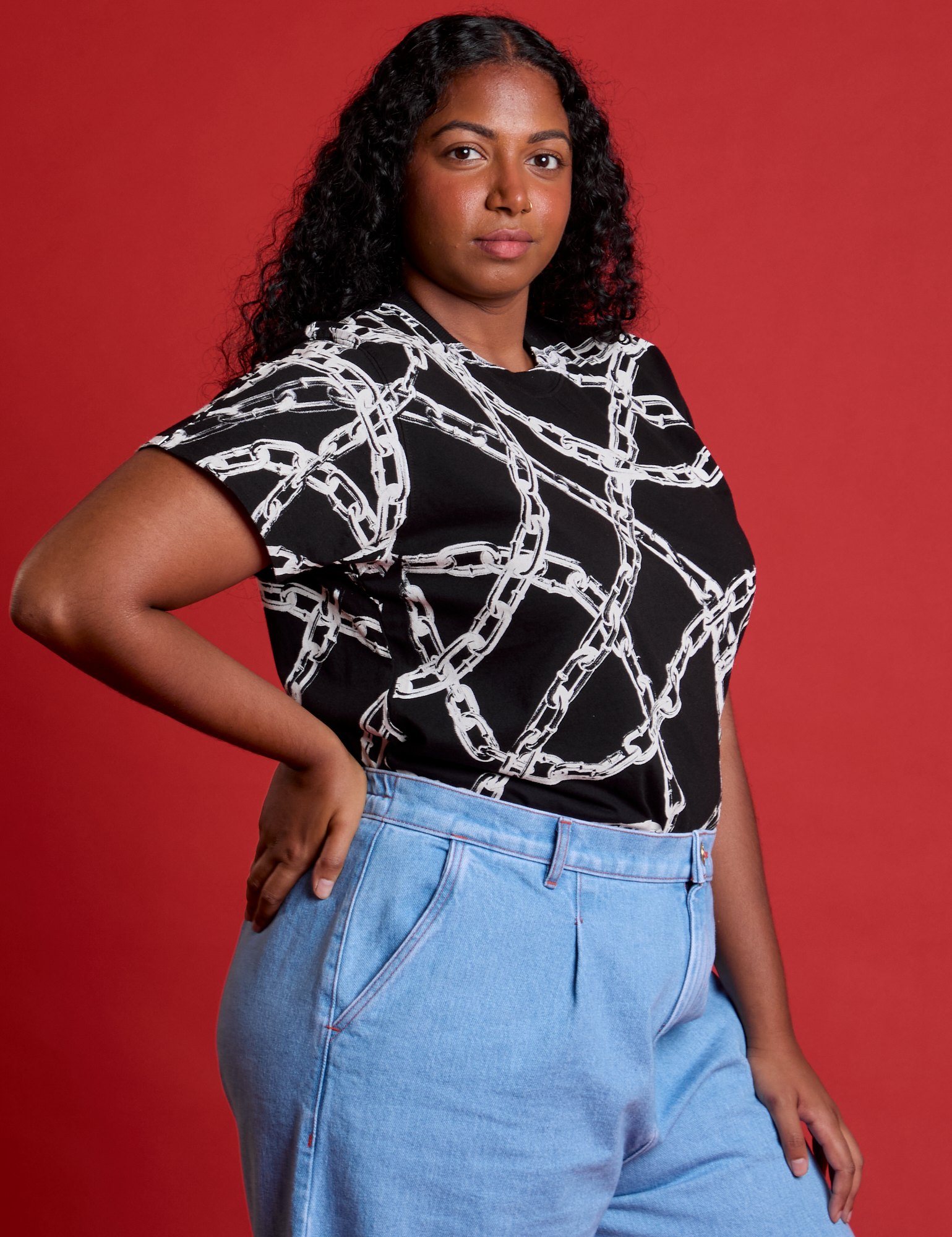 Front angled view of Chain Link Vintage Tee in Basic Black on Meghna