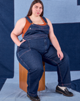 Marielena is wearing Indigo Denim Original Overalls in Dark Wash