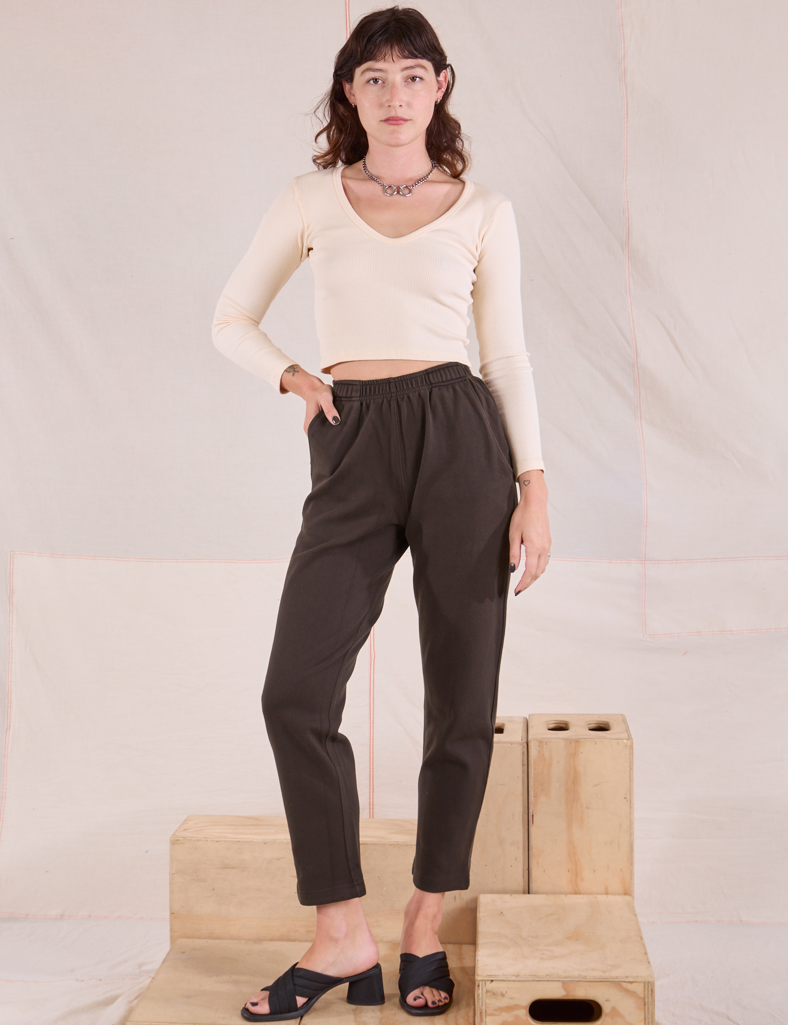 Alex is wearing Easy Pants in Espresso Brown and vintage tee off-white Long Sleeve V-Neck Tee