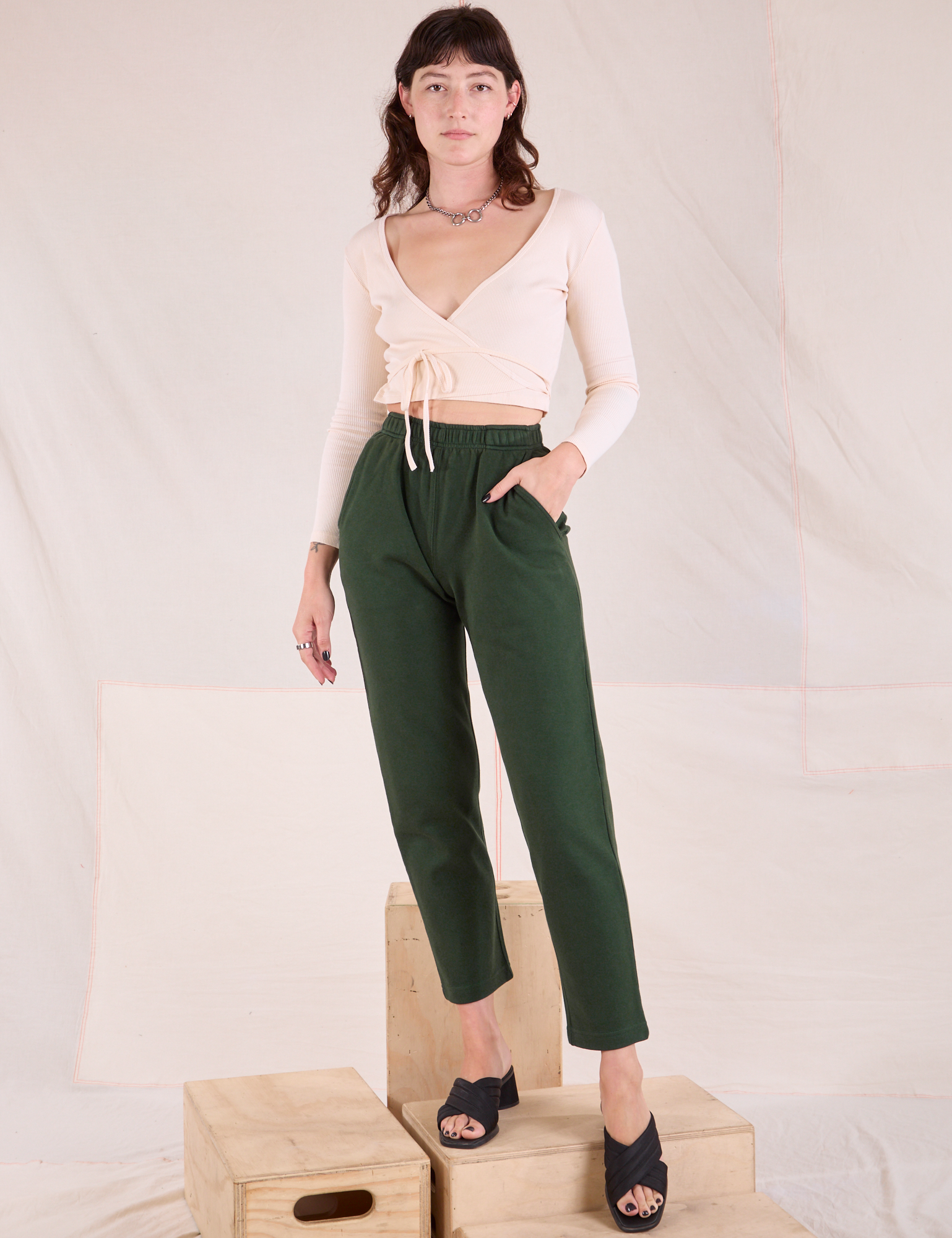 Alex is wearing Easy Pants in Swamp Green and vintage tee off-white Wrap Top