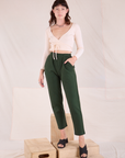 Alex is wearing Easy Pants in Swamp Green and vintage tee off-white Wrap Top