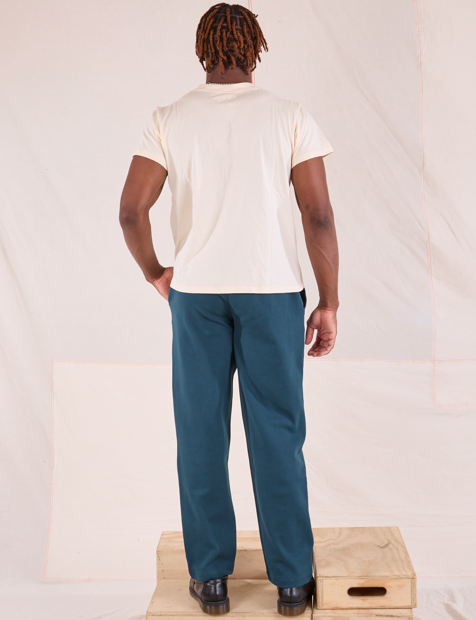 Back view of Easy Pants in Lagoon and Organic Vintage Tee in vintage tee off-white