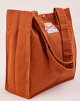 Angled view of Shopper Tote in Burnt Terracotta