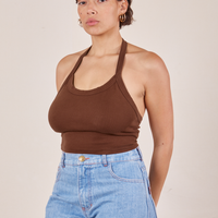 Tiara is wearing Halter Top in Fudgesicle Brown and light wash Sailor Jeans
