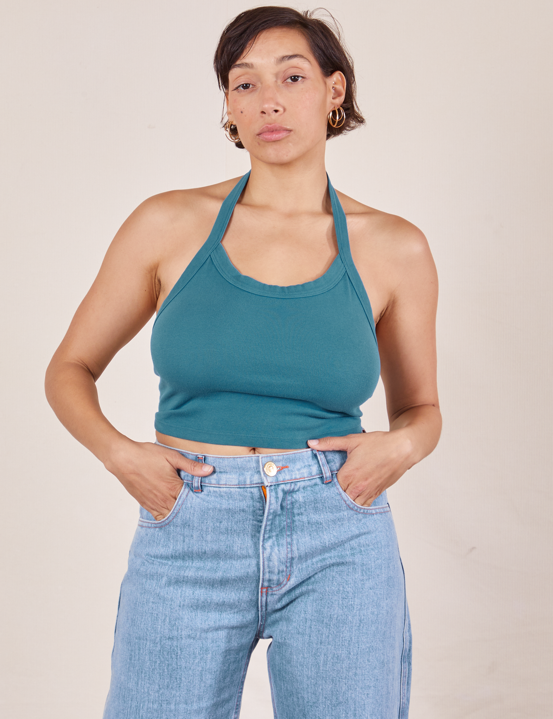 Tiara is 5'4" and wearing XS Halter Top in Marine Blue