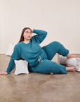 Marielena is wearing Cropped Rolled Cuff Sweatpants in Marine Blue and matching Heavyweight Crew Sweatshirt