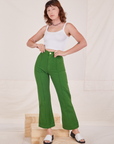 Alex is 5'8" and wearing XS Heritage Westerns in Lawn Green paired with Cropped Cami in vintage tee off-white
