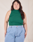 Ashley is 5'7" and wearing L Sleeveless Essential Turtleneck in Hunter Green